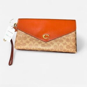 NWT Coach Signature Wyn Rust and Tan Clutch